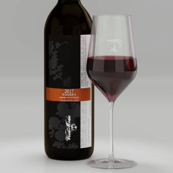 A pour of 2017 Barbera with label shown on bottle