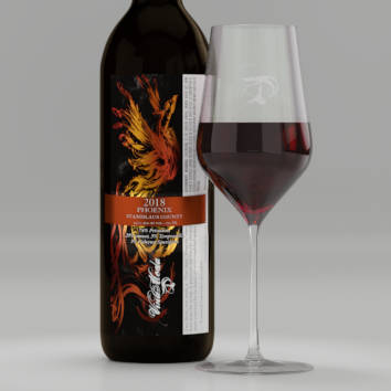 A pour of Phoenix next to bottle