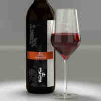 A pour of 2022 Tannat with label shown on bottle